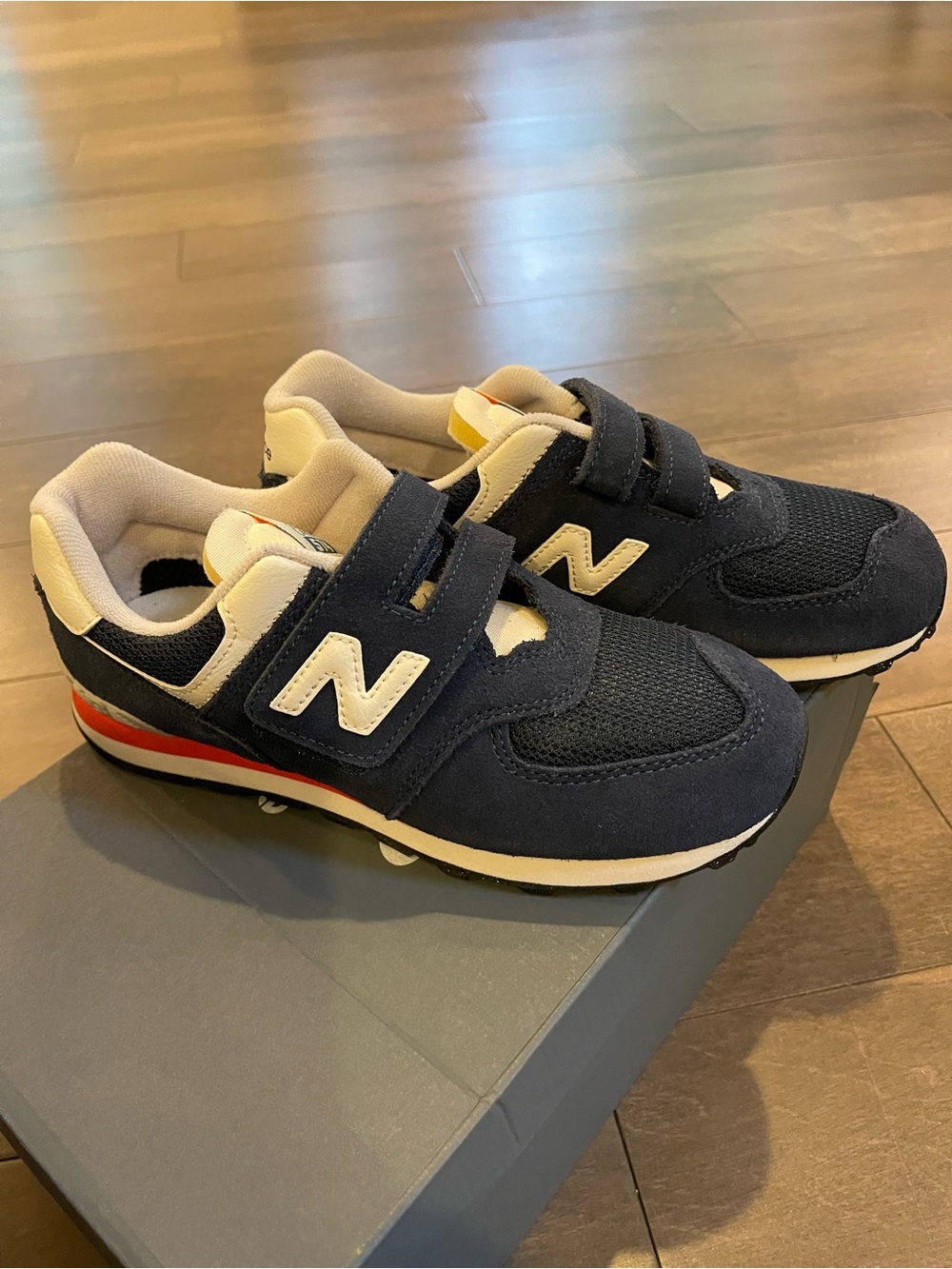 New Balance Kids 574 Hook & Loop Navy and White Velcro Sneakers with Red Accent